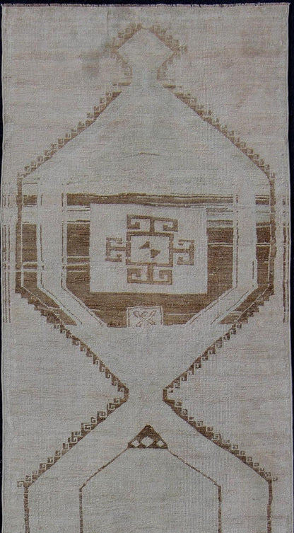 Vintage Turkish Geometric Oushak Runner with Medallions in Taupe and Brown Tri Medallion Oushak runner, rug tu - alk - 4897, country of origin / type: Turkey / Oushak, circa 1940 This Oushak carpet from mid - 20th century Turkey features a st... - Keivan Woven ArtsTU - ALK - 4897 - 10852Rug