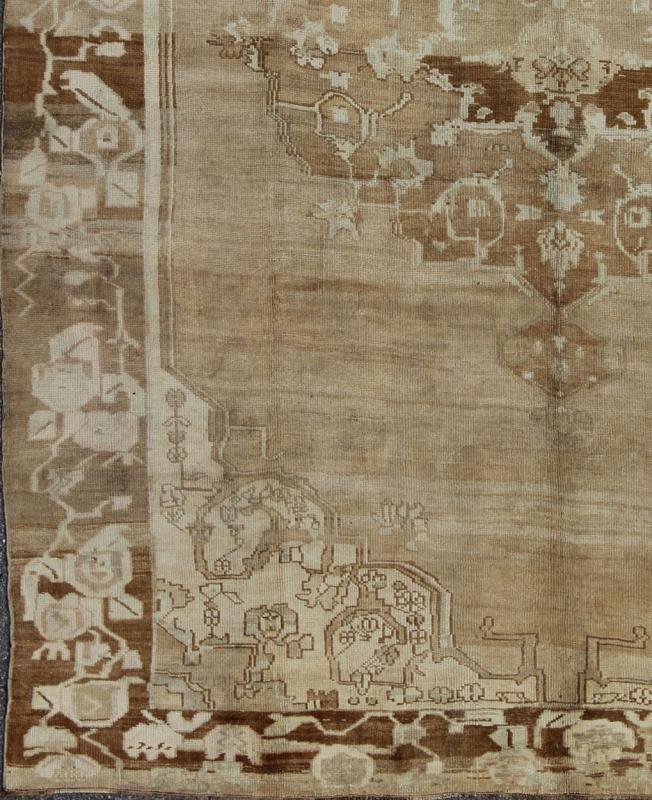 Brown, Tan and Ivory Vintage Turkish Oushak Rug with Floral Center Medallion, rug ars - 538, country of origin / type: Turkey / Oushak, circa mid - 20th century This vintage Turkish Oushak carpet (circa mid - 20th century) features a central, floral m... - Keivan Woven ArtsTU - ARS - 538 - 2444Rug