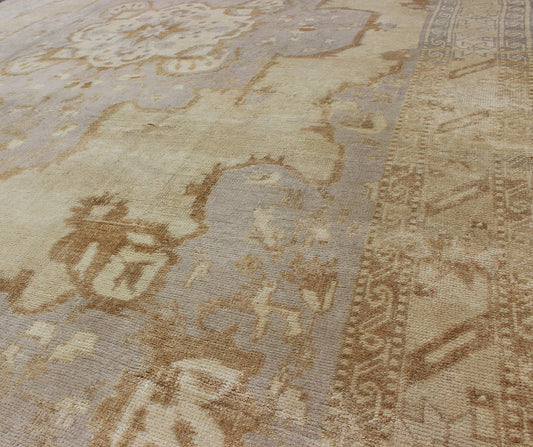 Vintage Turkish Oushak Rug with Medallion Design and Corniced Floral Border Enchanting in both color and design, this vintage Turkish piece was skillfully woven with subtly and beauty in mind. The cream - colored background receives a romantic flo... - Keivan Woven ArtsTU - ARS - 811 - 2434Rug