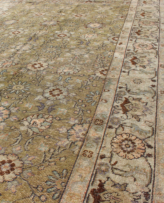 This broad antique Turkish Oushak runner is remarkably elegant in both color and design. The central field of olive green plays host to a variety interconnected blossoms in an all - over pattern with intermixed palmette motifs. The simplified inner and o... - Keivan Woven ArtsTU - CUM - 148 - 2400Rug