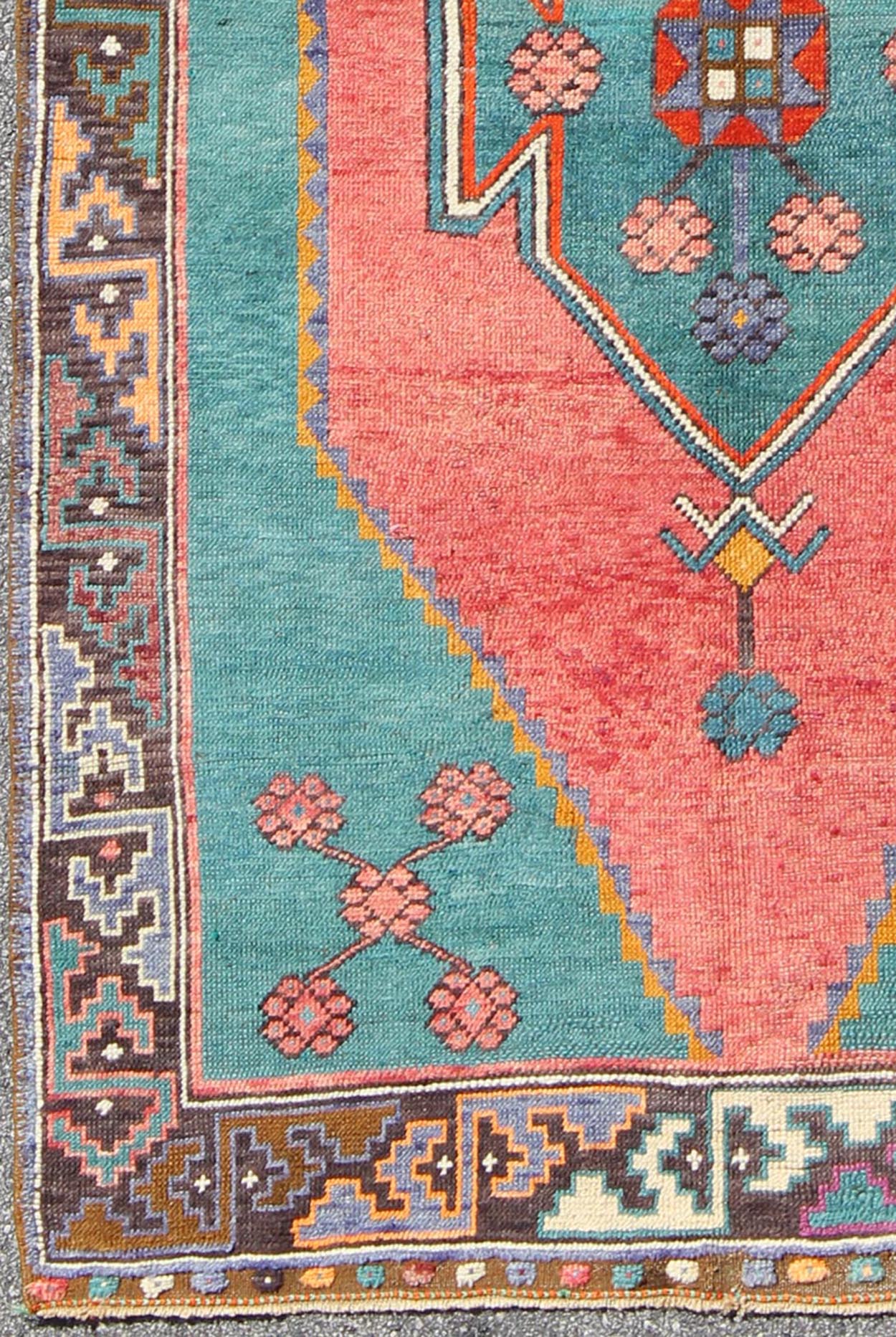 Tribal Design Vintage Turkish Rug in Teal, Blue, Green, Charcoal & Coral. Colorful rug, tribal rug. Colorful Turkish medallion with tribal design in teal, coral, background and complemented by deep multi colors in the repeating geometric motif c... - Keivan Woven ArtsTU - DUR - 136593 - 9532Rug