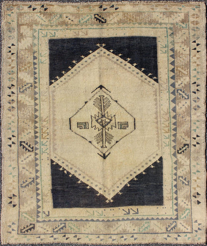 Vintage Turkish Oushak Rug with Central Medallion in Cream and Blue This beautiful rug from mid - 20th century is on a cream ground and home to the center medallion. Three ornate borders with arrows and variegated leaf patterns coordinate wit... - Keivan Woven ArtsTU - DUR - 3691 - 7899Rug