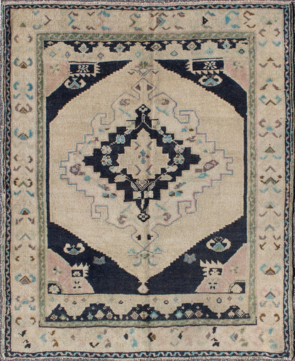 Vintage Hand Knotted Turkish Oushak Rug with Central Medallion in Cream and Blue This beautiful rug from mid - 20th century Turkey features a medallion with floral motifs surrounding it. The cream ground is home to the center medallion. Four dark ... - Keivan Woven ArtsTU - DUR - 3693 - 7903Rug