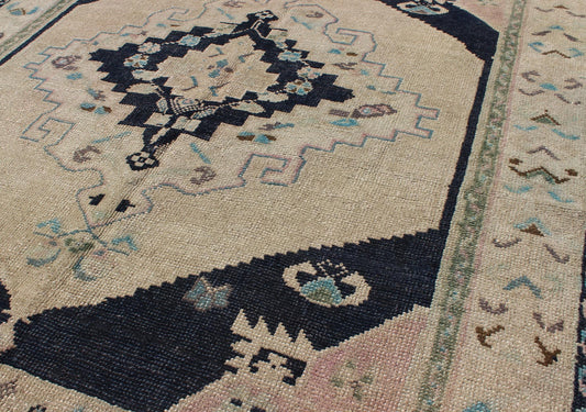 Vintage Hand Knotted Turkish Oushak Rug with Central Medallion in Cream and Blue This beautiful rug from mid - 20th century Turkey features a medallion with floral motifs surrounding it. The cream ground is home to the center medallion. Four dark ... - Keivan Woven ArtsTU - DUR - 3693 - 7903Rug