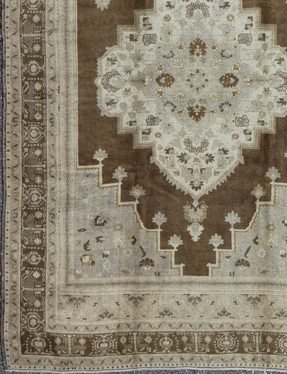 Vintage Turkish Oushak Rug in Brown Background and Neutral Colors Measures: 7'4 x 11'4 This lovely Turkish Oushak from the 1940's features a central medallion, which rests on a dark brown background, is surrounded by a light brown bor... - Keivan Woven ArtsTU - DUR - 506 - 3502Rug