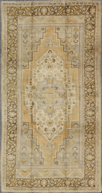 Vintage Turkish Medallion Oushak Rug in Gold, Taupe, Cream and Cocoa Measures: 6'8 x 12 This vintage Turkish Oushak features a bold design softened by unique, light tones. The border is chocolate brown and contains vines and flowers. Co... - Keivan Woven ArtsTU - DUR - 507 - 3508Rug