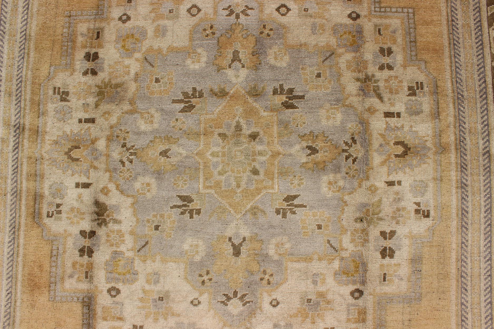 Vintage Turkish Medallion Oushak Rug in Gold, Taupe, Cream and Cocoa Measures: 6'8 x 12 This vintage Turkish Oushak features a bold design softened by unique, light tones. The border is chocolate brown and contains vines and flowers. Co... - Keivan Woven ArtsTU - DUR - 507 - 3508Rug