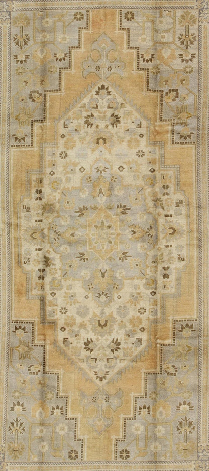 Vintage Turkish Medallion Oushak Rug in Gold, Taupe, Cream and Cocoa Measures: 6'8 x 12 This vintage Turkish Oushak features a bold design softened by unique, light tones. The border is chocolate brown and contains vines and flowers. Co... - Keivan Woven ArtsTU - DUR - 507 - 3508Rug