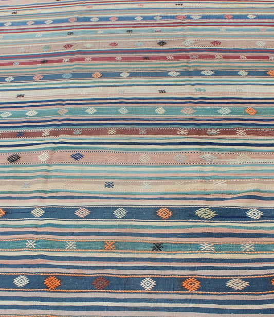 Colorful Vintage Turkish Kilim Rug with Horizontal Stripes and Tribal Designs, rug emd - 136530, country of origin / type: Turkey / Kilim, circa mid - 20th century Featuring tribal shapes with a spotted and speckled assortment of geometric elements,... - Keivan Woven ArtsTU - EMD - 136530 - 4938Rug