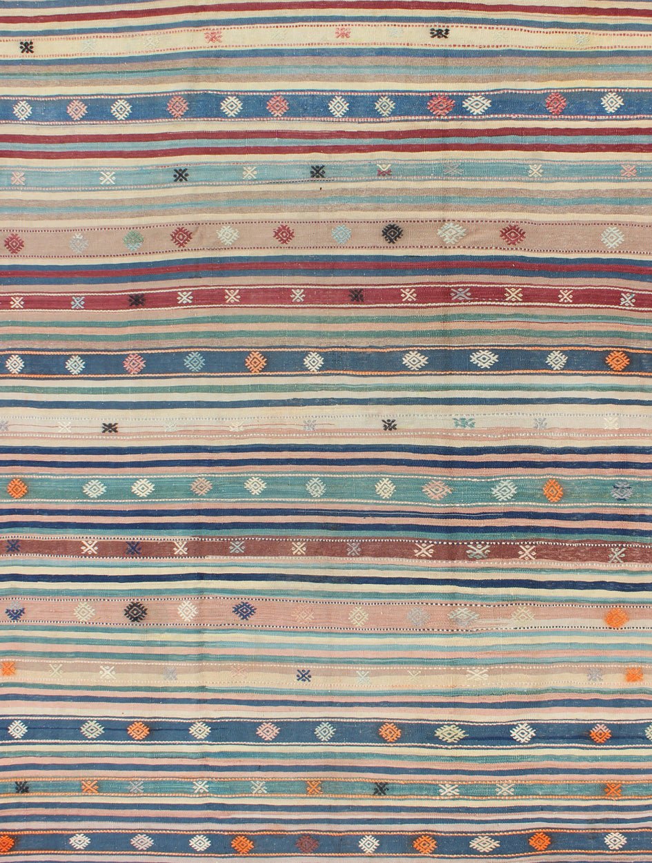 Colorful Vintage Turkish Kilim Rug with Horizontal Stripes and Tribal Designs, rug emd - 136530, country of origin / type: Turkey / Kilim, circa mid - 20th century Featuring tribal shapes with a spotted and speckled assortment of geometric elements,... - Keivan Woven ArtsTU - EMD - 136530 - 4938Rug
