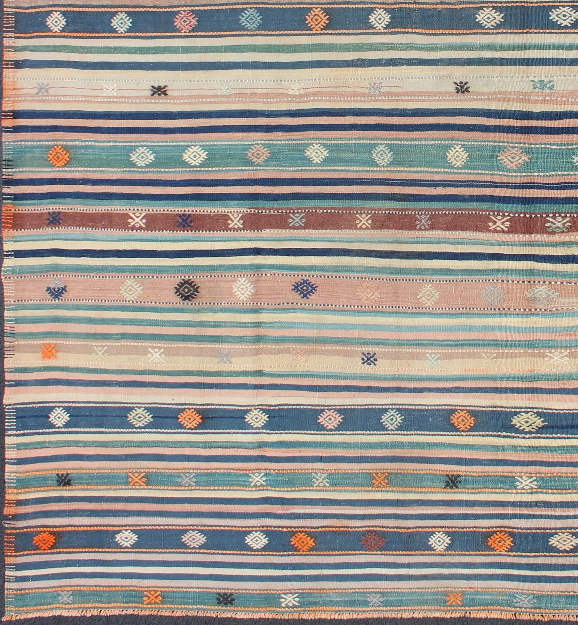 Colorful Vintage Turkish Kilim Rug with Horizontal Stripes and Tribal Designs, rug emd - 136530, country of origin / type: Turkey / Kilim, circa mid - 20th century Featuring tribal shapes with a spotted and speckled assortment of geometric elements,... - Keivan Woven ArtsTU - EMD - 136530 - 4938Rug