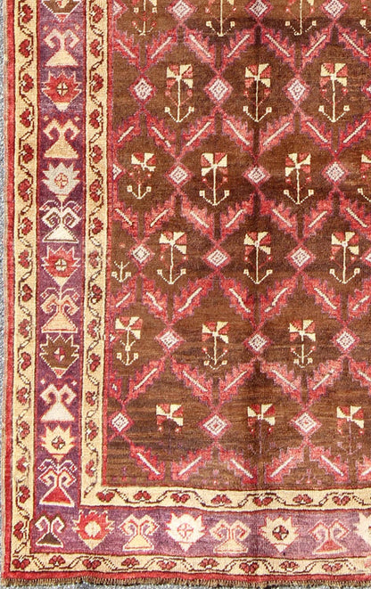 Vintage Turkish Oushak Carpet with All - Over Tribal Design in Red, Purple & Brown: Produced in mid - 20th century Turkey, this vintage Oushak is characterized by a comely and highly representative Oushak composition. Building on traditional designs, this ... - Keivan Woven ArtsTU - EMD - 3368 - 6161Rug