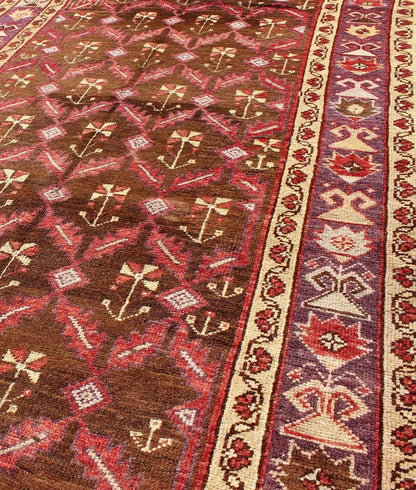 Vintage Turkish Oushak Carpet with All - Over Tribal Design in Red, Purple & Brown: Produced in mid - 20th century Turkey, this vintage Oushak is characterized by a comely and highly representative Oushak composition. Building on traditional designs, this ... - Keivan Woven ArtsTU - EMD - 3368 - 6161Rug