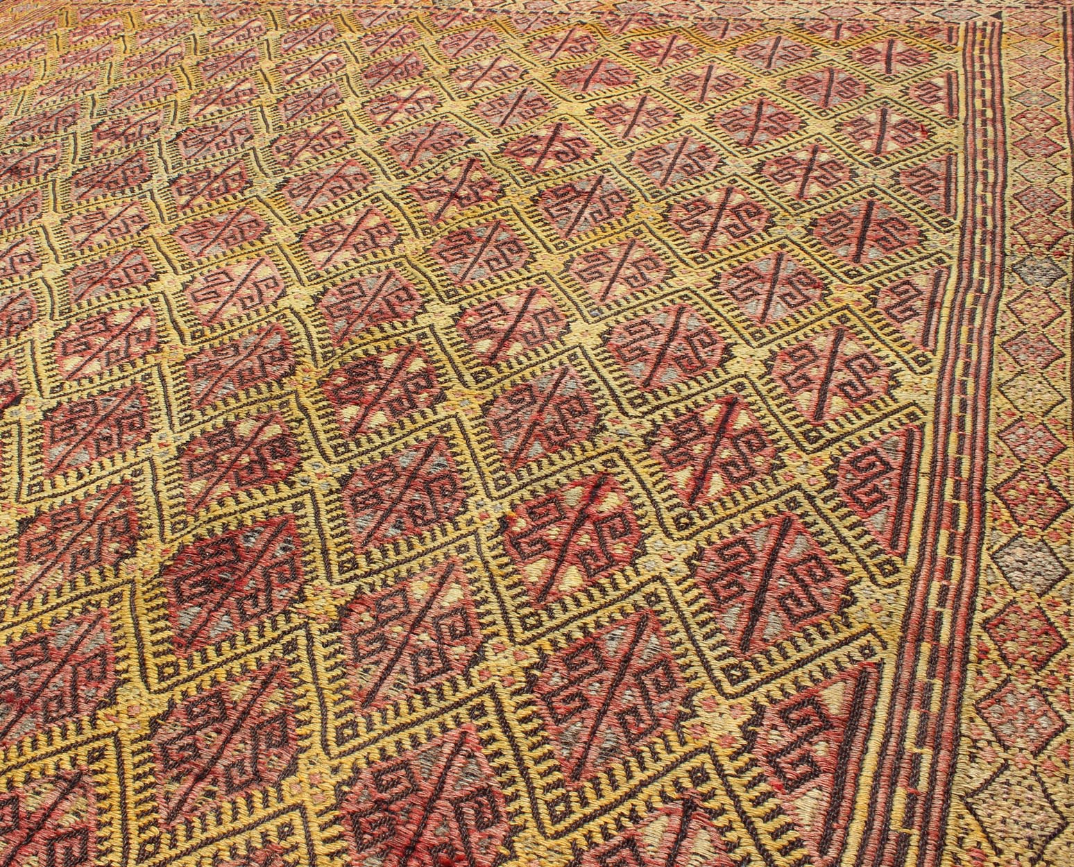 Vintage Turkish Embroidered Kilim Rug With Diamond Design in Yellow and Red This colorful vintage, 20th century embroidered Kilim rug features an all - over diamond pattern woven with a well - preserved and vibrant color palette of Green, soft orange, ... - Keivan Woven ArtsTU - EMD - 3371 - 6165Rug