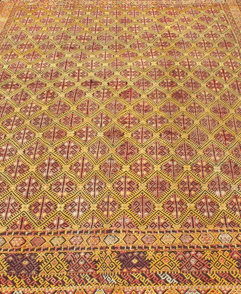 Vintage Turkish Embroidered Kilim Rug With Diamond Design in Yellow and Red This colorful vintage, 20th century embroidered Kilim rug features an all - over diamond pattern woven with a well - preserved and vibrant color palette of Green, soft orange, ... - Keivan Woven ArtsTU - EMD - 3371 - 6165Rug