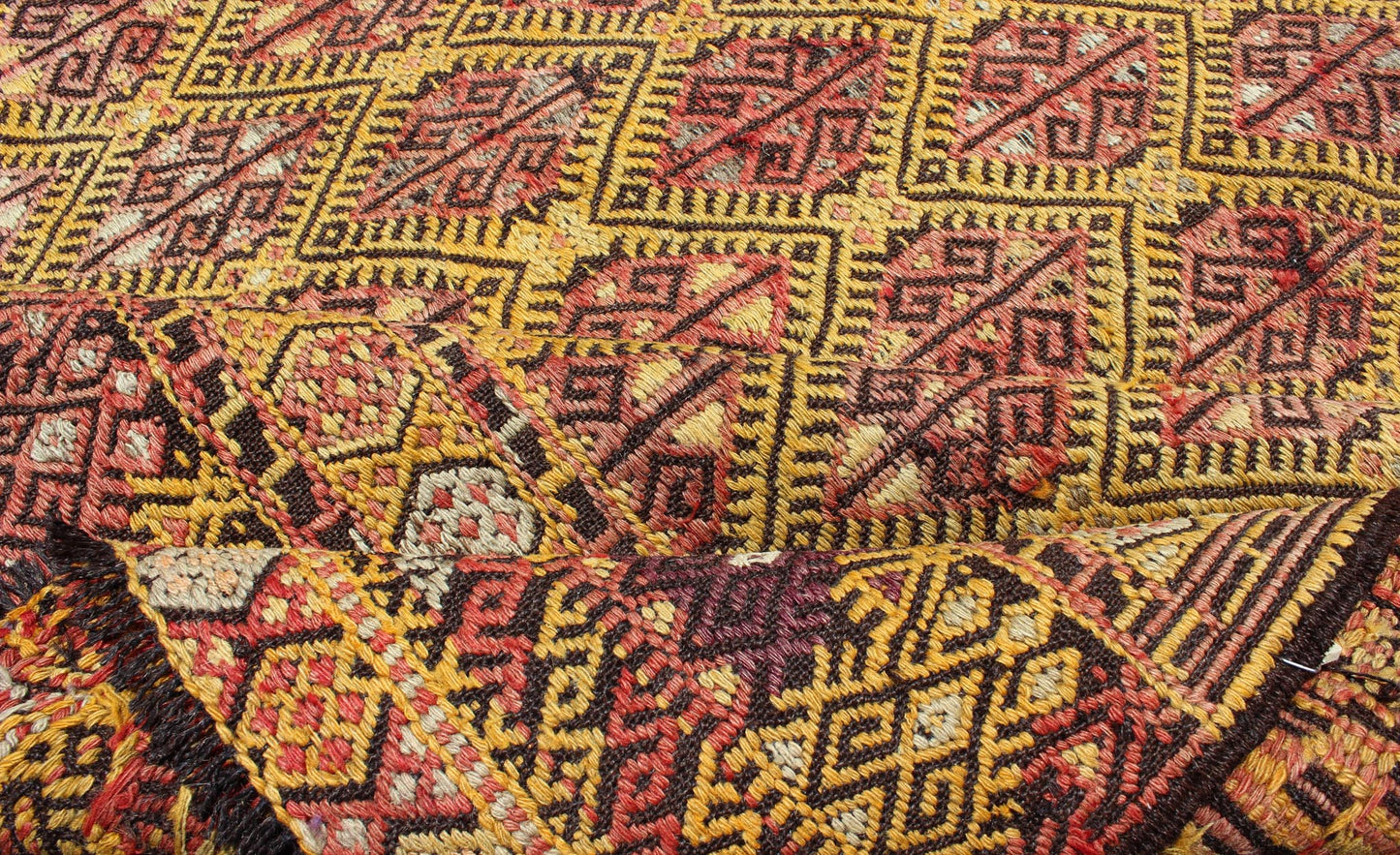 Vintage Turkish Embroidered Kilim Rug With Diamond Design in Yellow and Red This colorful vintage, 20th century embroidered Kilim rug features an all - over diamond pattern woven with a well - preserved and vibrant color palette of Green, soft orange, ... - Keivan Woven ArtsTU - EMD - 3371 - 6165Rug