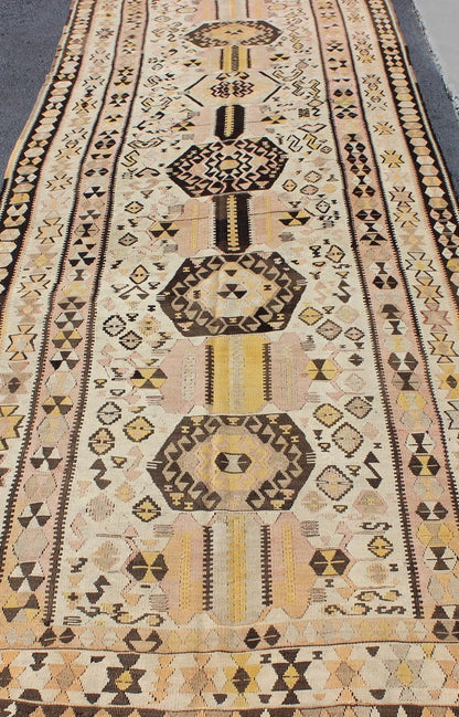 Vintage Turkish kilim gallery rug with tribal medallion design in pink and yellow. Keivan Woven Arts / rug TU - EMD - 3424, country of origin / type: Turkey / Kilim, circa Mid - 20th century. This vintage Turkish Kilim gallery rug (circa mid - 20th cent... - Keivan Woven ArtsTU - EMD - 3424 - 6171Rug