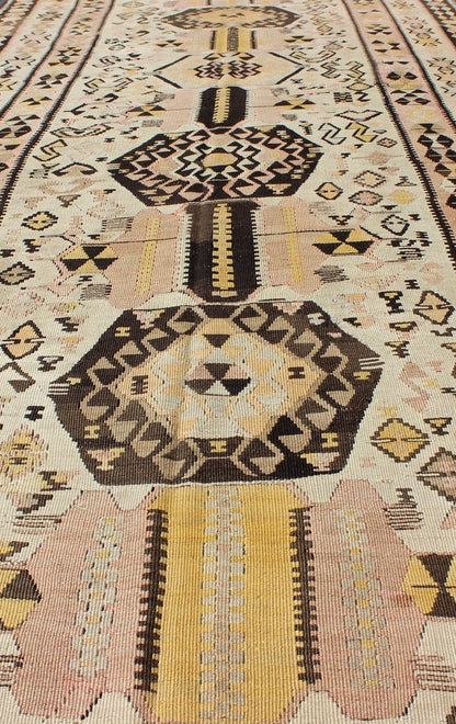 Vintage Turkish kilim gallery rug with tribal medallion design in pink and yellow. Keivan Woven Arts / rug TU - EMD - 3424, country of origin / type: Turkey / Kilim, circa Mid - 20th century. This vintage Turkish Kilim gallery rug (circa mid - 20th cent... - Keivan Woven ArtsTU - EMD - 3424 - 6171Rug