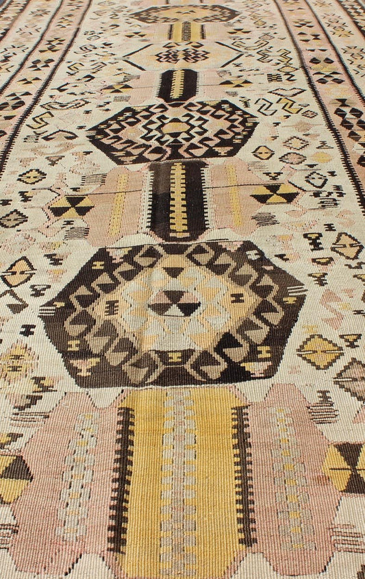 Vintage Turkish kilim gallery rug with tribal medallion design in pink and yellow. Keivan Woven Arts / rug TU - EMD - 3424, country of origin / type: Turkey / Kilim, circa Mid - 20th century. This vintage Turkish Kilim gallery rug (circa mid - 20th cent... - Keivan Woven ArtsTU - EMD - 3424 - 6171Rug
