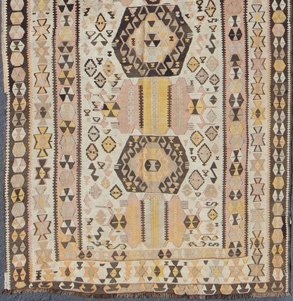 Vintage Turkish kilim gallery rug with tribal medallion design in pink and yellow. Keivan Woven Arts / rug TU - EMD - 3424, country of origin / type: Turkey / Kilim, circa Mid - 20th century. This vintage Turkish Kilim gallery rug (circa mid - 20th cent... - Keivan Woven ArtsTU - EMD - 3424 - 6171Rug