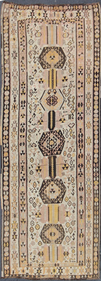 Vintage Turkish kilim gallery rug with tribal medallion design in pink and yellow. Keivan Woven Arts / rug TU - EMD - 3424, country of origin / type: Turkey / Kilim, circa Mid - 20th century. This vintage Turkish Kilim gallery rug (circa mid - 20th cent... - Keivan Woven ArtsTU - EMD - 3424 - 6171Rug