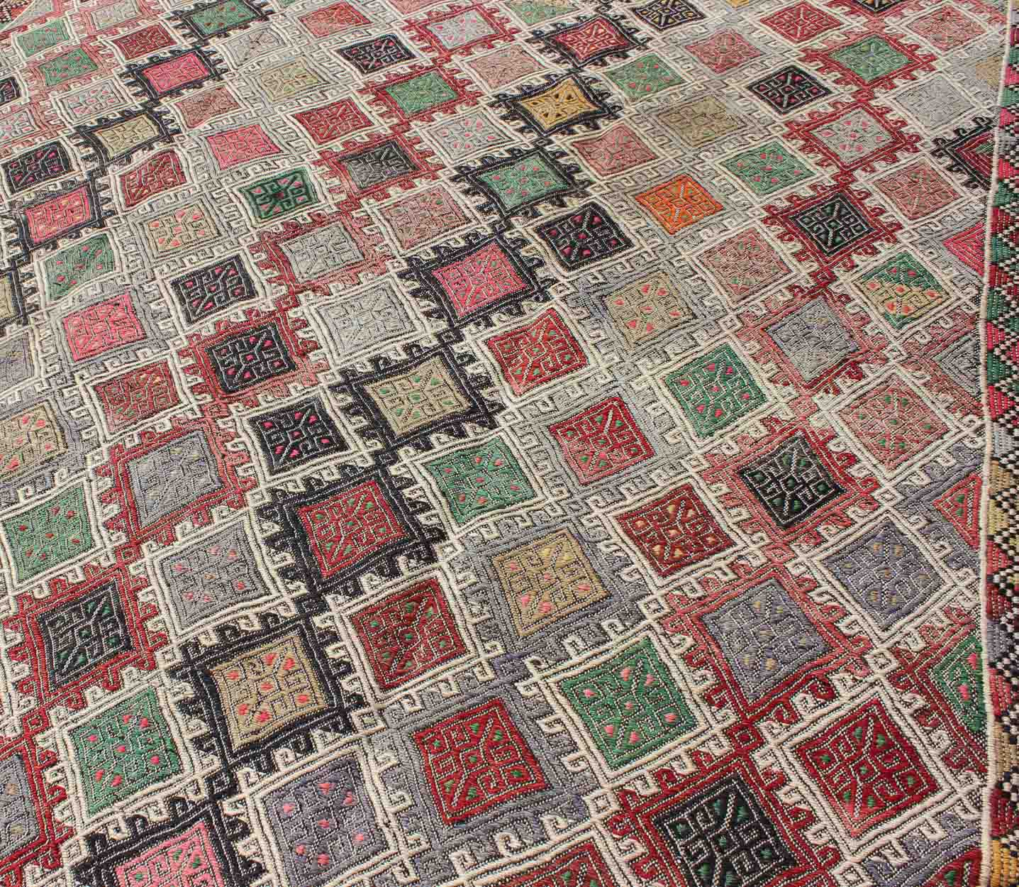 Geometric Embroidered Mid - Century Flat - Weave Kilim Rug From Turkey. This marvelous geometric embroidered Kilim rug showcases an all - over diamond pattern in the background and an understated border, paired with a distinct set of random colors such as pi... - Keivan Woven ArtsTU - EMD - 3427 - 6177Rug