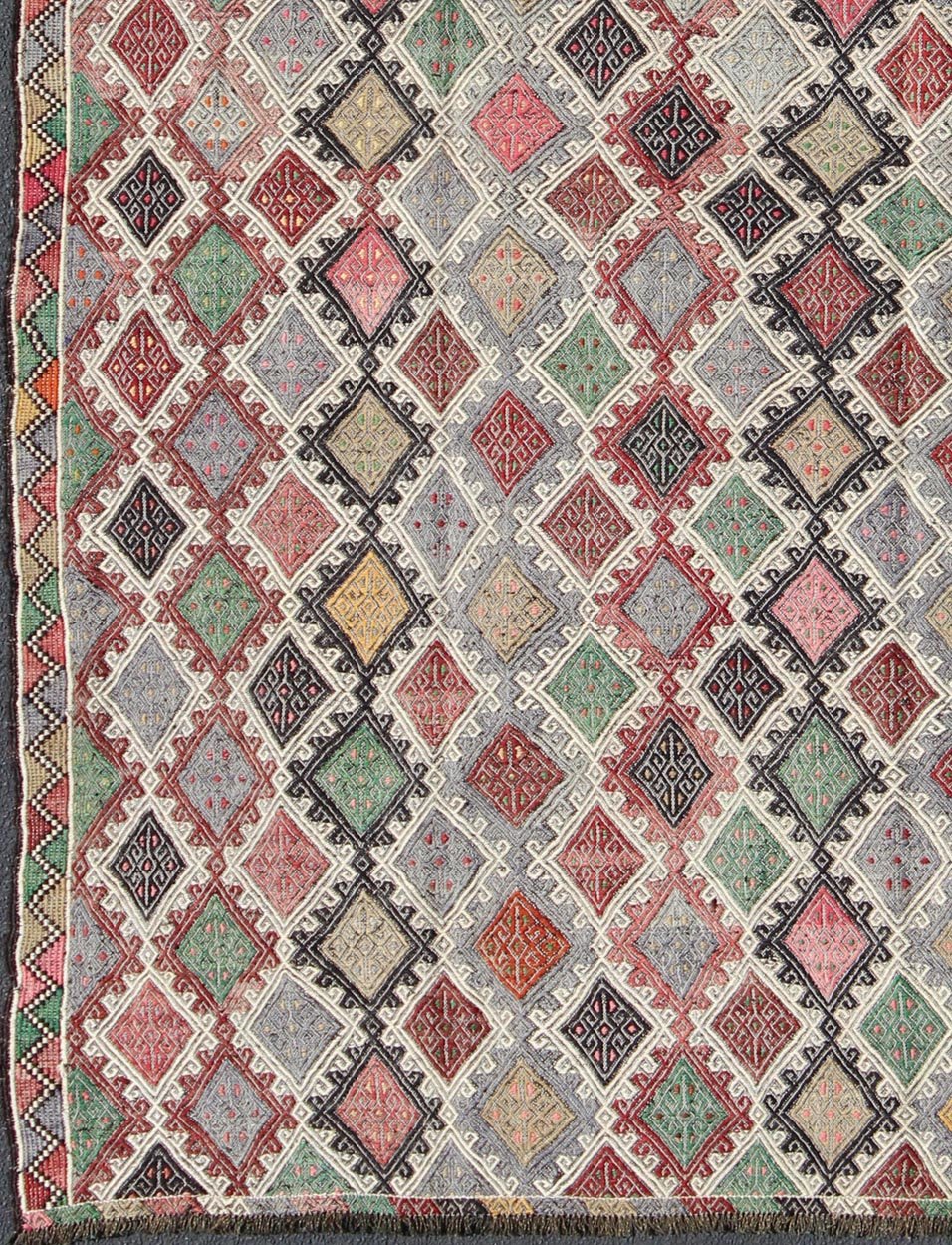 Geometric Embroidered Mid - Century Flat - Weave Kilim Rug From Turkey. This marvelous geometric embroidered Kilim rug showcases an all - over diamond pattern in the background and an understated border, paired with a distinct set of random colors such as pi... - Keivan Woven ArtsTU - EMD - 3427 - 6177Rug