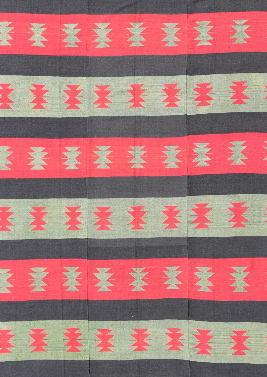 Vintage Turkish Kilim rug with tribal shapes and horizontal stripes in red and green, rug emd - 3428, country of origin / type: Turkey / Kilim, circa mid - 20th century. Featuring tribal shapes rendered in a repeating horizontal stripe design, this ... - Keivan Woven ArtsTU - EMD - 3428 - 6183Rug