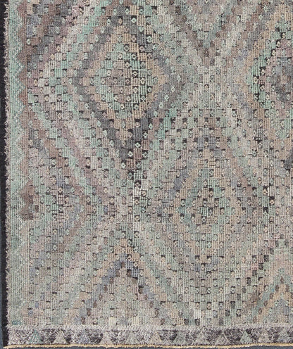 Vintage Jajeem Flat - Weave Rug - This unique Jajeem features a multitude of diamond shapes in the background combined with a simple outer border. The seemingly random use of pastel colors such as gray, light green, light yellow, brown, cream and lavender... - Keivan Woven ArtsTU - EMD - 95008 - 3469Rug