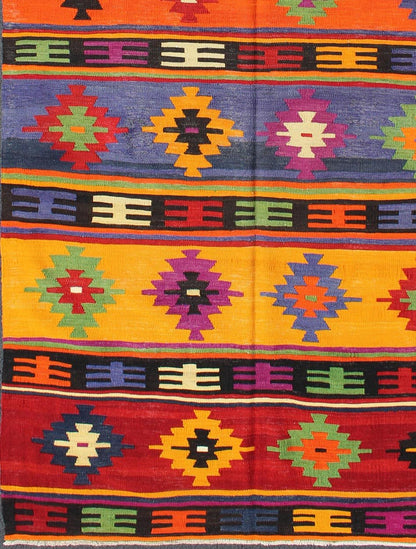 Colorful and Vibrant Turkish Vintage Kilim Rug with Repeating Diamond Pattern: This brilliant and colorful Turkish Kilim rug has a repeating diamond pattern, which is articulated on a background of thick bands of alternating color. This piece is vibran... - Keivan Woven ArtsTU - EMD - 95035 - 3477Rug