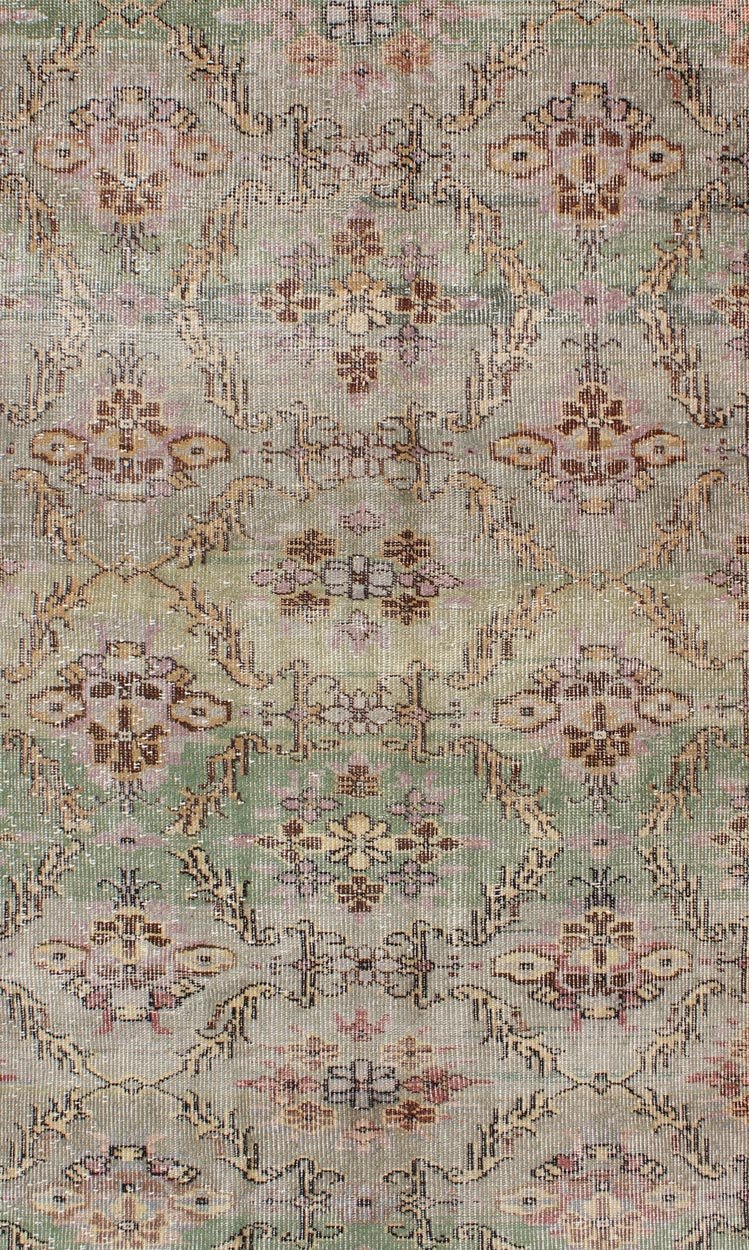 Distressed Vintage Turkish Art Deco Rug with All - Over Vining Flowers Design in Green And Lavender by Keivan Woven Arts/ rug/ TU - ERD - 4574, country of origin / type: Turkey / Art Deco, circa mid - 20th century Measures: 3'10 x 6'9. Alive with... - Keivan Woven ArtsTU - ERD - 4574 - 4942Rug