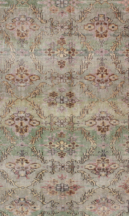 Distressed Vintage Turkish Art Deco Rug with All - Over Vining Flowers Design in Green And Lavender by Keivan Woven Arts/ rug/ TU - ERD - 4574, country of origin / type: Turkey / Art Deco, circa mid - 20th century Measures: 3'10 x 6'9. Alive with... - Keivan Woven ArtsTU - ERD - 4574 - 4942Rug