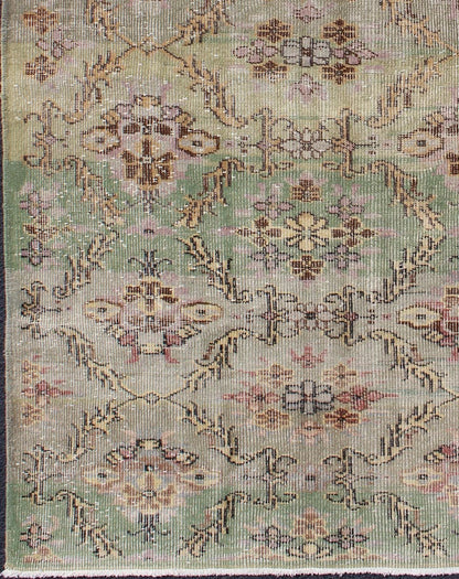 Distressed Vintage Turkish Art Deco Rug with All - Over Vining Flowers Design in Green And Lavender by Keivan Woven Arts/ rug/ TU - ERD - 4574, country of origin / type: Turkey / Art Deco, circa mid - 20th century Measures: 3'10 x 6'9. Alive with... - Keivan Woven ArtsTU - ERD - 4574 - 4942Rug