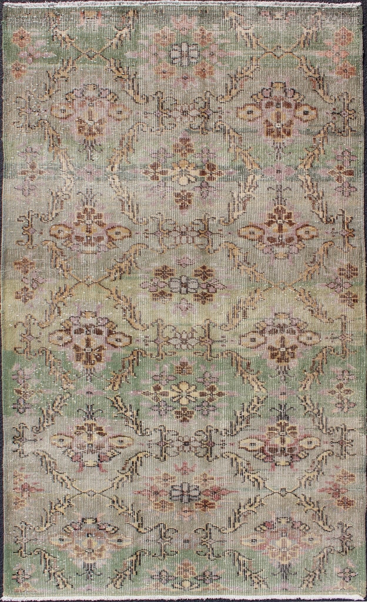 Distressed Vintage Turkish Art Deco Rug with All - Over Vining Flowers Design in Green And Lavender by Keivan Woven Arts/ rug/ TU - ERD - 4574, country of origin / type: Turkey / Art Deco, circa mid - 20th century Measures: 3'10 x 6'9. Alive with... - Keivan Woven ArtsTU - ERD - 4574 - 4942Rug