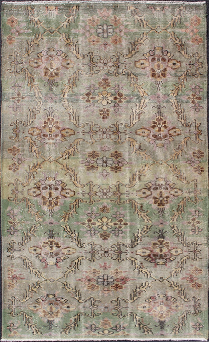 Distressed Vintage Turkish Art Deco Rug with All - Over Vining Flowers Design in Green And Lavender by Keivan Woven Arts/ rug/ TU - ERD - 4574, country of origin / type: Turkey / Art Deco, circa mid - 20th century Measures: 3'10 x 6'9. Alive with... - Keivan Woven ArtsTU - ERD - 4574 - 4942Rug