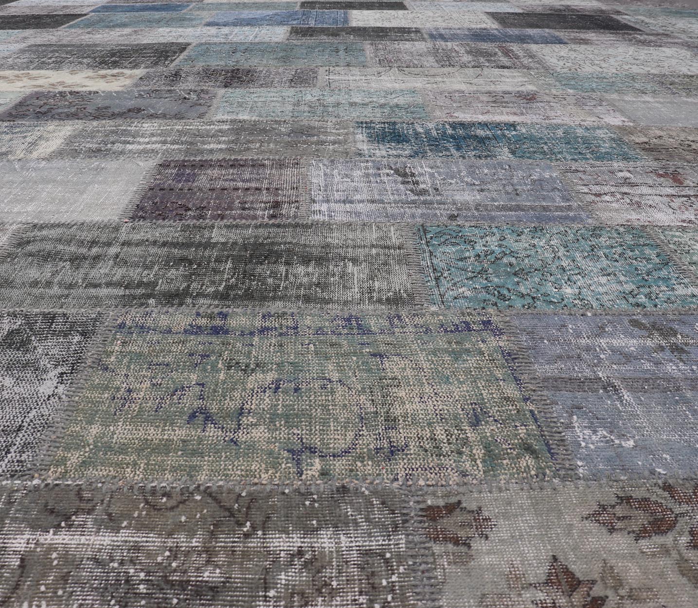 Large Turkish Patchwork Rug in Gray, Green, Blue, Brown and Neutral Tones. Keivan Woven Arts / rug TU - ERD - 7669 - TU - ERD - 7671, country of origin / type: Turkey / Mid - Century Modern, circa Mid - 20th Century. Measures: 13'4 x 20'4 This vintage... - Keivan Woven ArtsTU - ERD - 7669 - TU - ERD - 7671 - 23643Rug