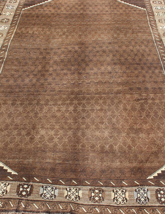 Vintage Turkish Kars Rug With a All - Over Lattce Design in Brown Tones This striking vintage Turkish carpet, from the mountainous eastern Turkey, bears a beautiful base palette of warm sienna with decorative elements in ivory. The central fie... - Keivan Woven ArtsTU - HAC - 09 - 2414Rug