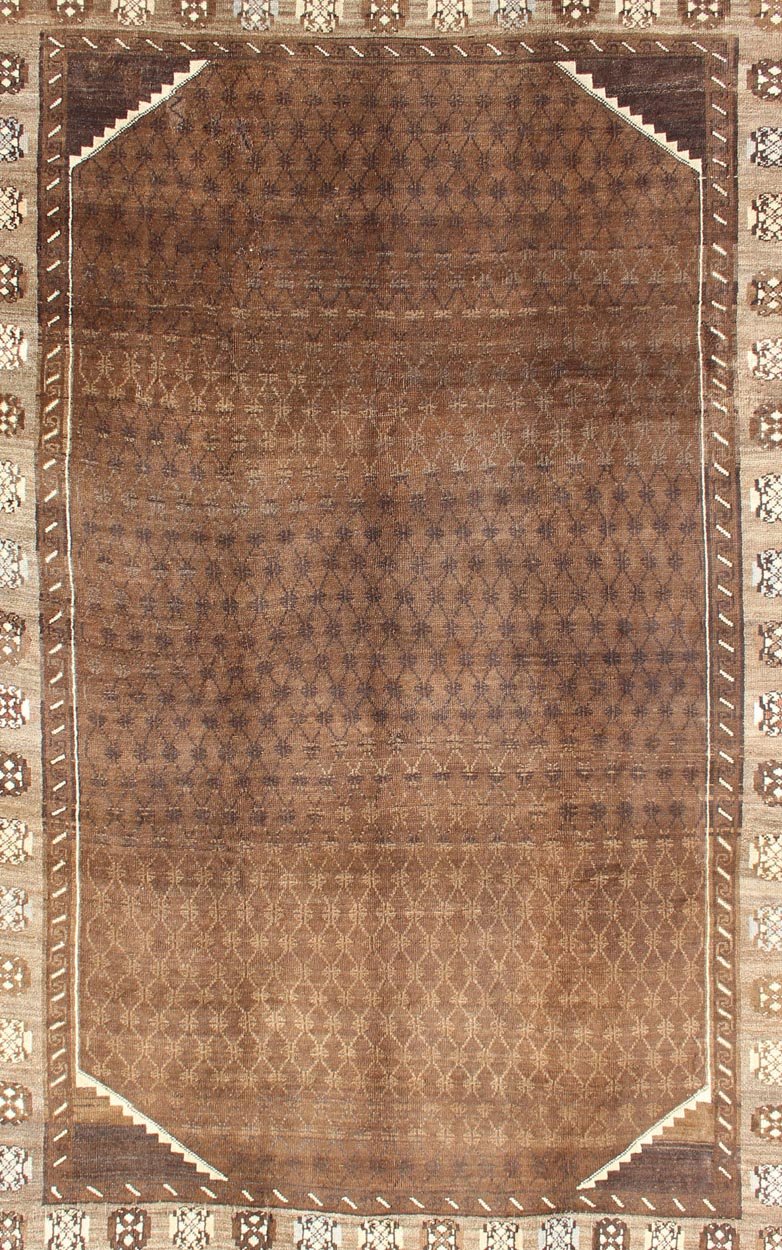 Vintage Turkish Kars Rug With a All - Over Lattce Design in Brown Tones This striking vintage Turkish carpet, from the mountainous eastern Turkey, bears a beautiful base palette of warm sienna with decorative elements in ivory. The central fie... - Keivan Woven ArtsTU - HAC - 09 - 2414Rug