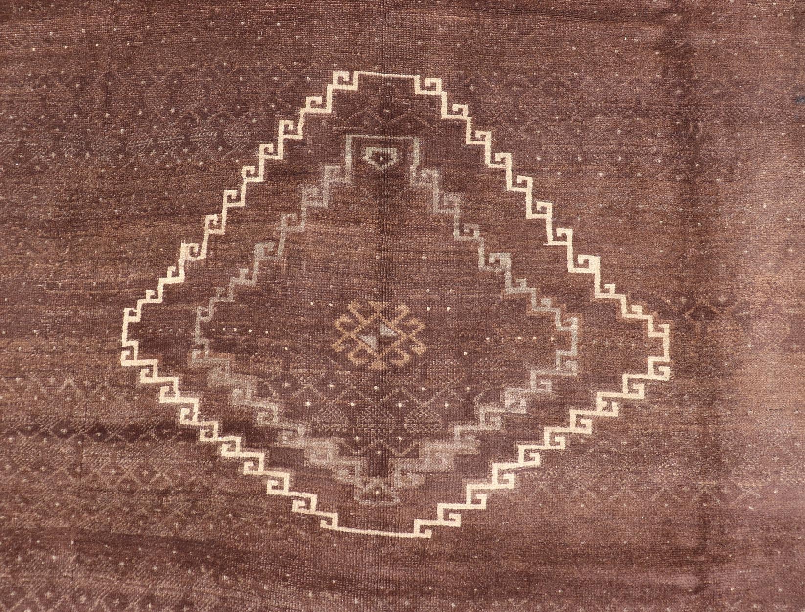 Vintage Turkish Kars Rug with a Modern Design in Shades of Brown and Ivory. Measures: 7'7 x 10'4. This wonderful Turkish rug, from eastern Turkey, displays a chocolate brown background with a small, repeating geometric pattern in the background a... - Keivan Woven ArtsTU - IHS - 123002 - 3648Rug