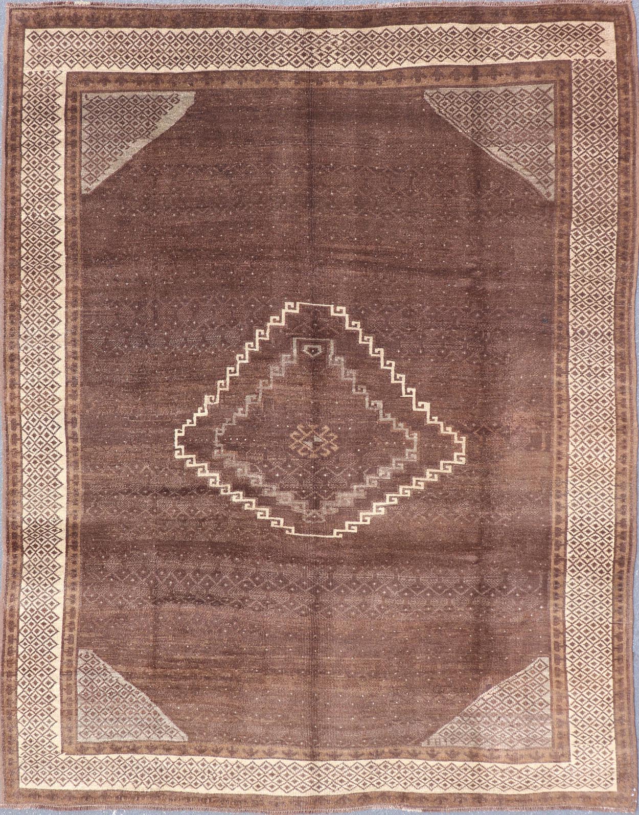 Vintage Turkish Kars Rug with a Modern Design in Shades of Brown and Ivory. Measures: 7'7 x 10'4. This wonderful Turkish rug, from eastern Turkey, displays a chocolate brown background with a small, repeating geometric pattern in the background a... - Keivan Woven ArtsTU - IHS - 123002 - 3648Rug