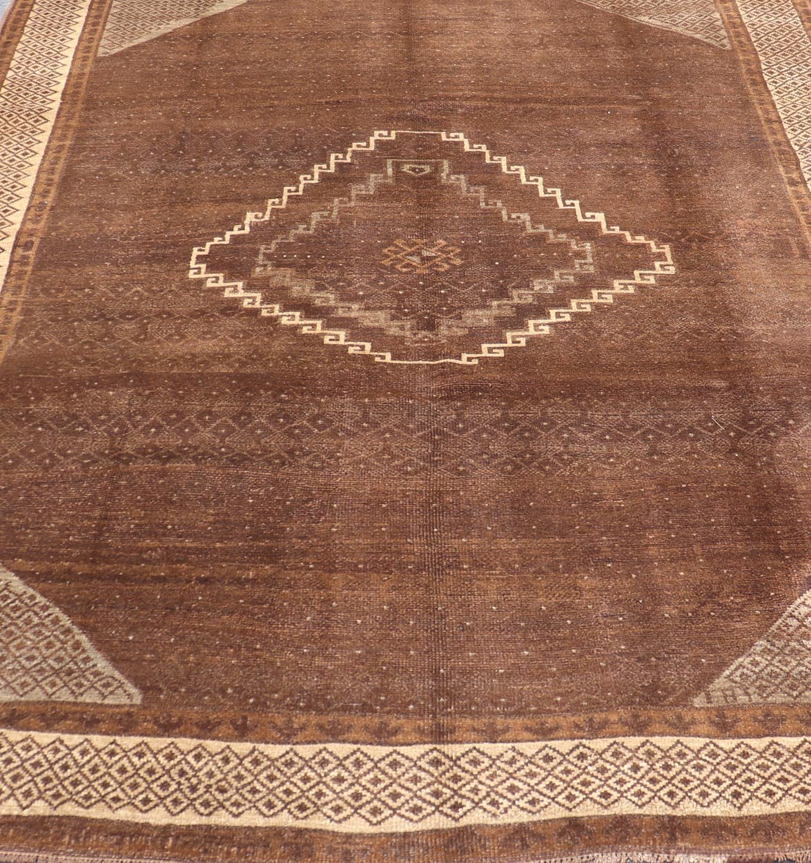 Vintage Turkish Kars Rug with a Modern Design in Shades of Brown and Ivory. Measures: 7'7 x 10'4. This wonderful Turkish rug, from eastern Turkey, displays a chocolate brown background with a small, repeating geometric pattern in the background a... - Keivan Woven ArtsTU - IHS - 123002 - 3648Rug