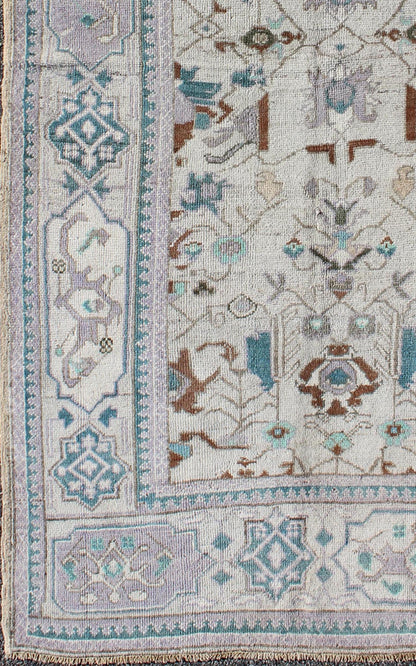 Vintage All - Over Floral Turkish Oushak Area Rug in Cream, Blue, Lilac and Red Measures: 4'4 x 8 This vintage Turkish Oushak carpet (circa mid - 20th century) features an all - over design of sub - geometric floral motifs atop of a creamy backgr... - Keivan Woven ArtsTU - IHS - 123347 - 3638Rug