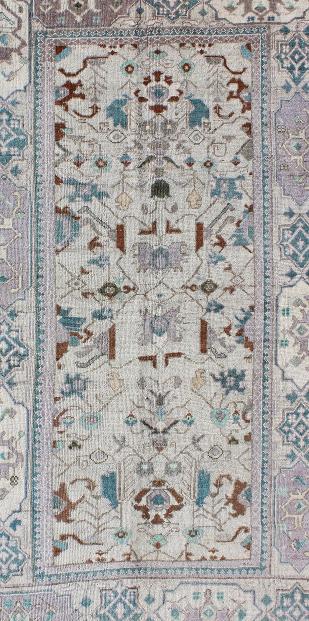 Vintage All - Over Floral Turkish Oushak Area Rug in Cream, Blue, Lilac and Red Measures: 4'4 x 8 This vintage Turkish Oushak carpet (circa mid - 20th century) features an all - over design of sub - geometric floral motifs atop of a creamy backgr... - Keivan Woven ArtsTU - IHS - 123347 - 3638Rug
