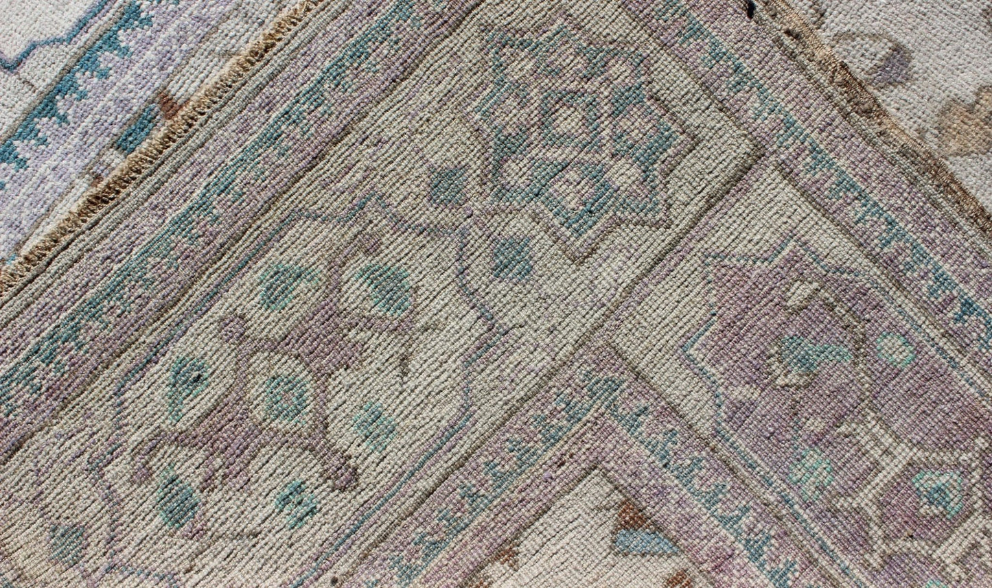 Vintage All - Over Floral Turkish Oushak Area Rug in Cream, Blue, Lilac and Red Measures: 4'4 x 8 This vintage Turkish Oushak carpet (circa mid - 20th century) features an all - over design of sub - geometric floral motifs atop of a creamy backgr... - Keivan Woven ArtsTU - IHS - 123347 - 3638Rug