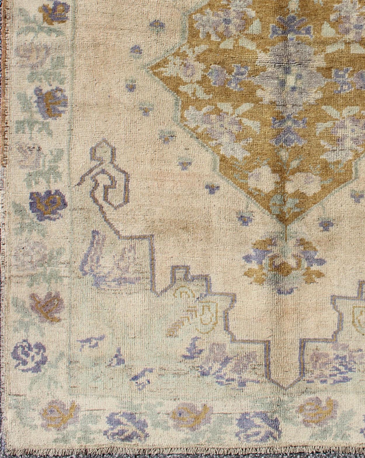 Classic Medallion Oushak Vintage Rug in Taupe, Purple, Cream, and Green This soft and cheerful Oushak carpet proudly displays a unique color combination in any carpet. On the center of this rug lays a central medallion of rich gold color. T... - Keivan Woven ArtsTU - IHS - 123408 - 3644Rug
