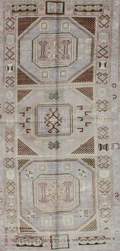 Lavender and teal vintage Turkish Oushak rug with tribal / geometric medallions. Keivan Woven Arts / rug TU - IHS - 95156, country of origin type: Turkey Oushak, circa mid - 20th century The lavender background of this vintage Oushak rug from Turkey (... - Keivan Woven ArtsTU - IHS - 95156 - 4554Rug