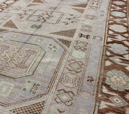 Lavender and teal vintage Turkish Oushak rug with tribal / geometric medallions. Keivan Woven Arts / rug TU - IHS - 95156, country of origin type: Turkey Oushak, circa mid - 20th century The lavender background of this vintage Oushak rug from Turkey (... - Keivan Woven ArtsTU - IHS - 95156 - 4554Rug