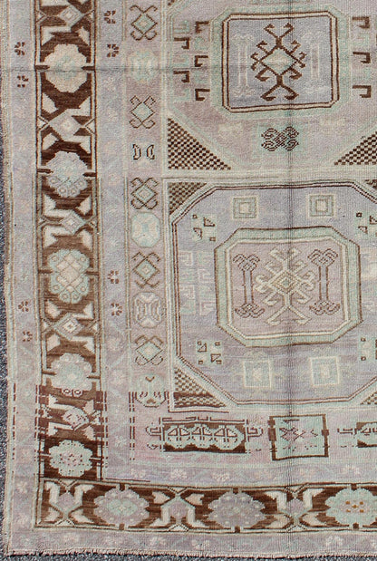 Lavender and teal vintage Turkish Oushak rug with tribal / geometric medallions. Keivan Woven Arts / rug TU - IHS - 95156, country of origin type: Turkey Oushak, circa mid - 20th century The lavender background of this vintage Oushak rug from Turkey (... - Keivan Woven ArtsTU - IHS - 95156 - 4554Rug