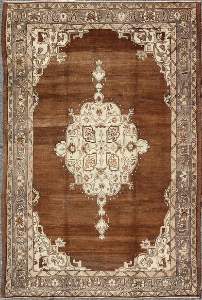 Vintage Turkish Oushak Rug with Floral Motifs in Chocolate Brown, Ivory, Taupe: This beautiful rug from early 20th century Turkey features a Classic Oushak design, which is enhanced by lustrous wool. The chocolate - brown ground is home to the centre med... - Keivan Woven ArtsTU - ISA - 136544 - 5241Rug