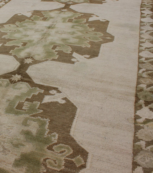 Green Turkish Oushak Runner This lovely Oushak runner displays three elegant medallions of multi - green colors on a solid cream field. The variety of green colors includes olive green, crocodile green and seaweed green. The minimal border coordin... - Keivan Woven ArtsTU - ISA - 3362 - 5740Rug